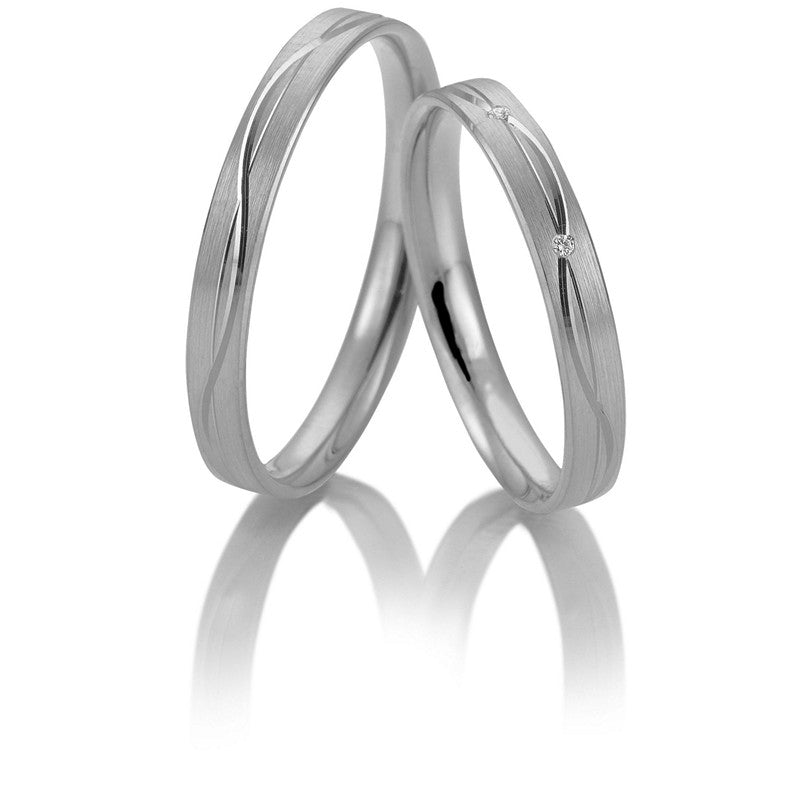 Stilrene Breuning vielsesringe i 9 eller 14 karat hvidguld med 0,017 ct diamanter og silkemat overflade.